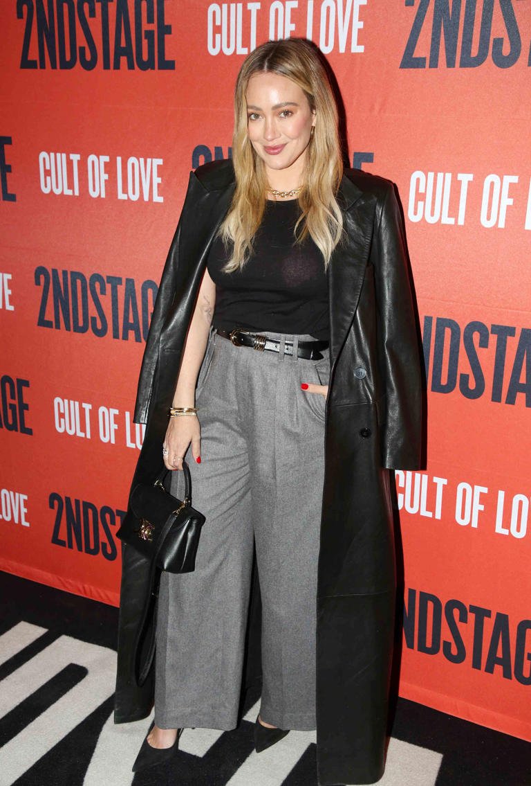 Hilary Duff posing on the red carpet at a public event, representing her return to music after a 10-year break.