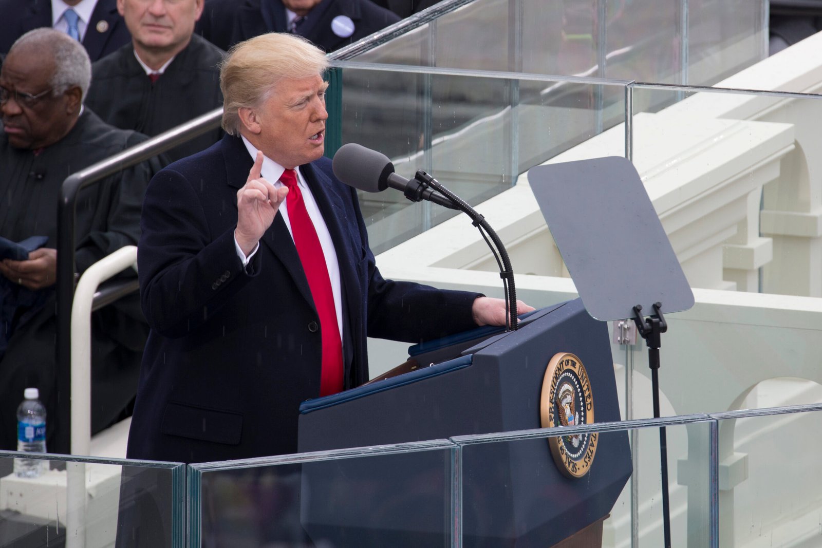 President Donald Trump speaking at a podium during an official event