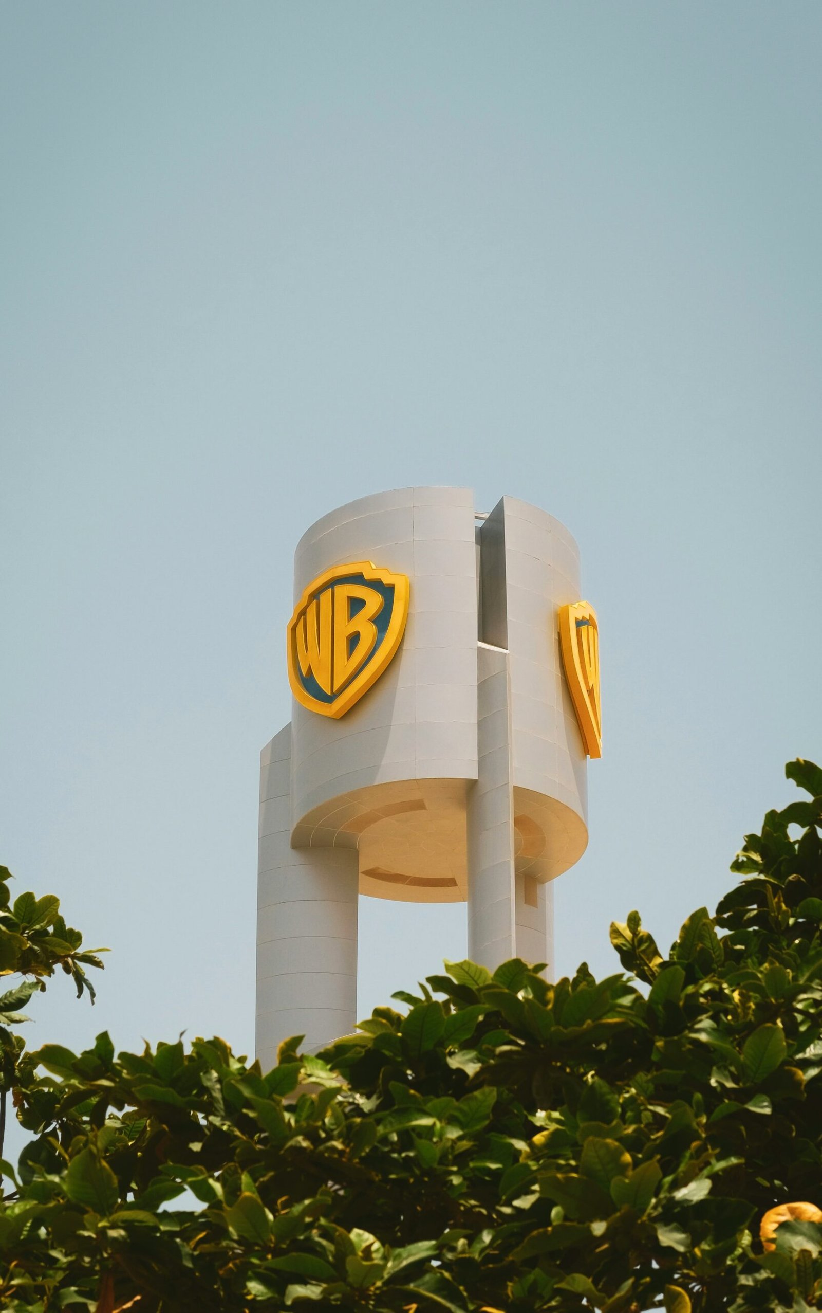 Warner Bros studio tower with iconic WB logo