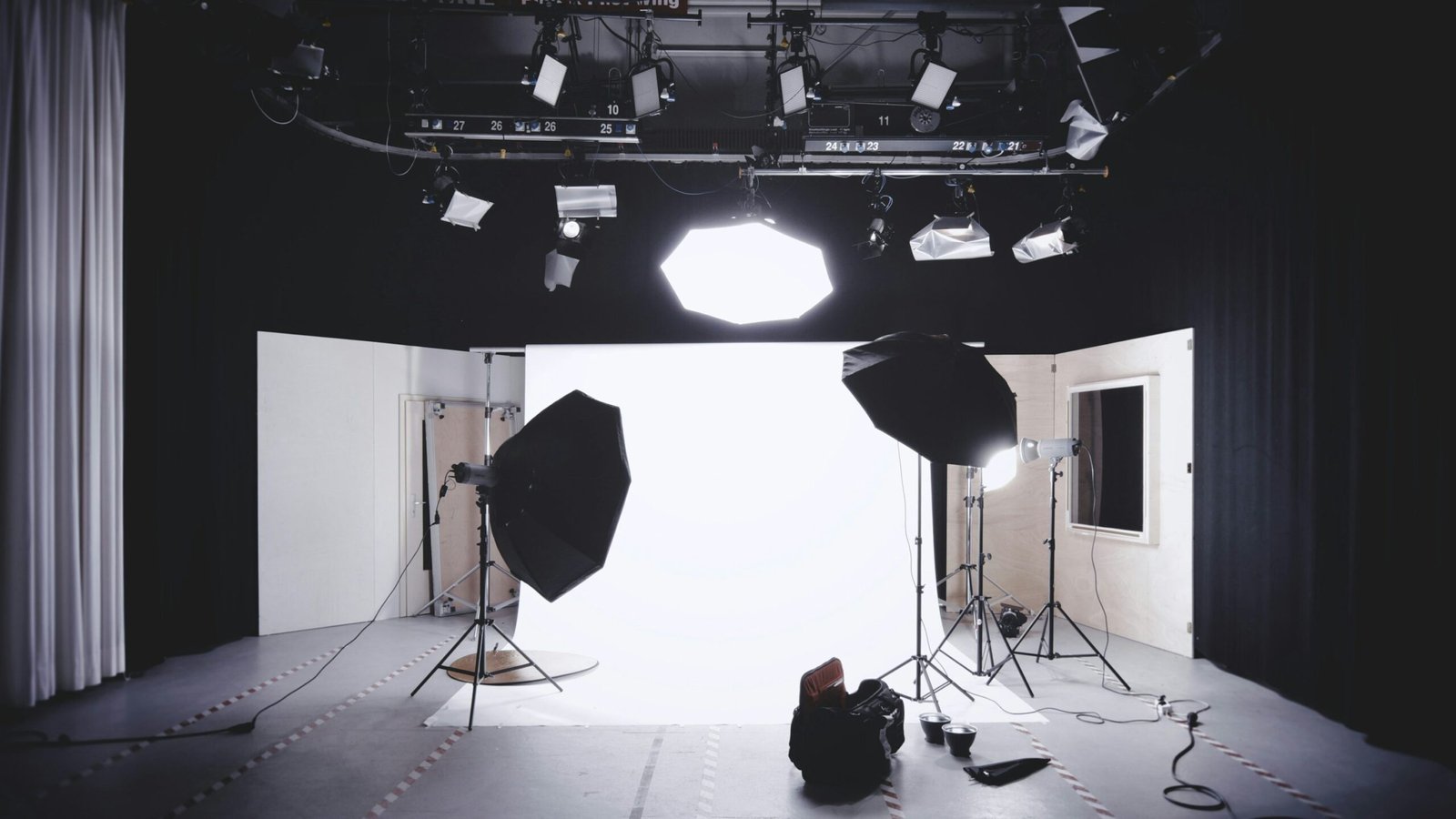 Professional Hollywood style interview studio setup with soft lighting and photography equipment.