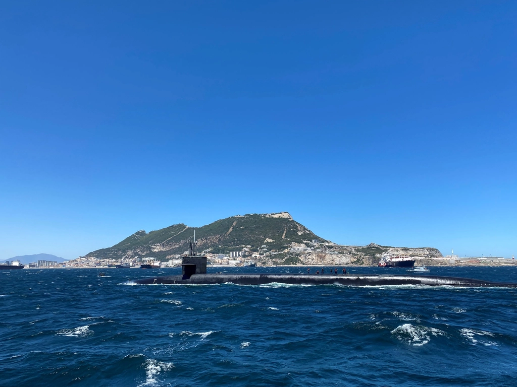 A navy submarine surfaced at sea, representing China's submarine-launched missile test